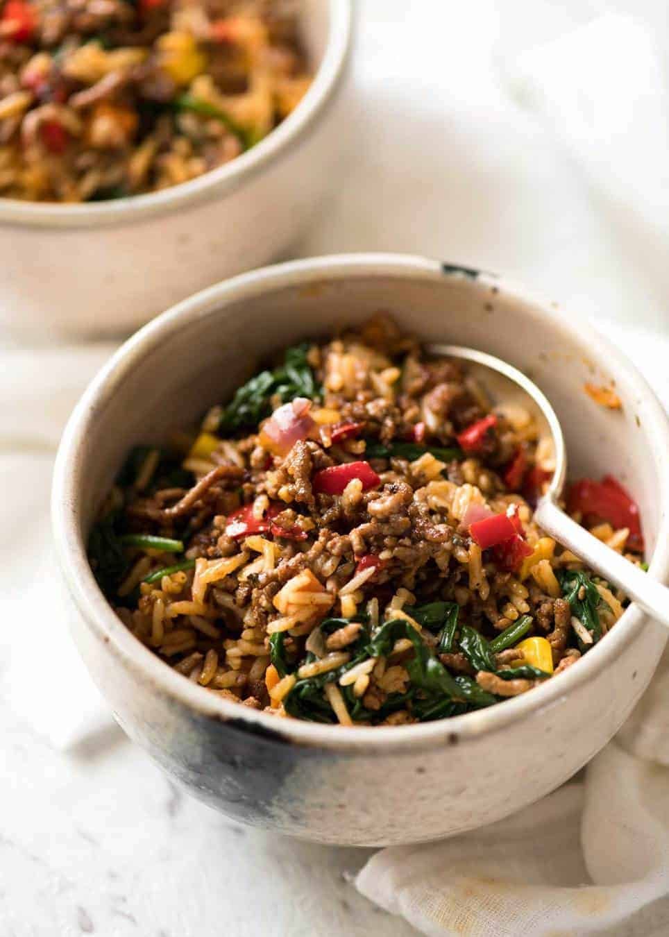 A quick, fabulous midweek meal - this ground Beef and Rice is made by browning ground beef, then cooking it with flavoured rice and loads of veggies. Irresistibly delicious! staging.recipetineats.com