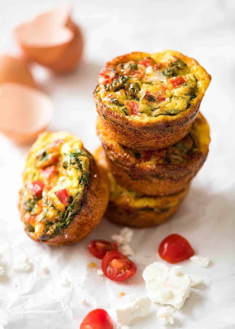 Healthy doesn't have to be bland! These Healthy Egg Muffins are a great grab & go breakfast option. Egg, spinach, feta, cherry tomatoes and bell peppers/capsicum. staging.recipetineats.com