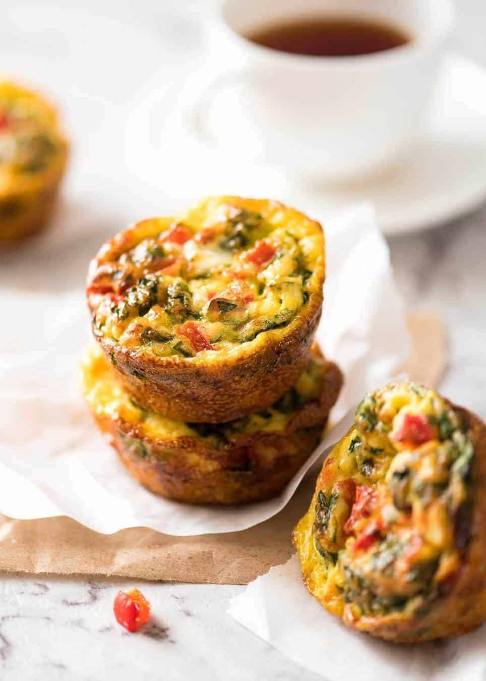 Healthy doesn't have to be bland! These Healthy Egg Muffins are a great grab & go breakfast option. Egg, spinach, feta, cherry tomatoes and bell peppers/capsicum. staging.recipetineats.com