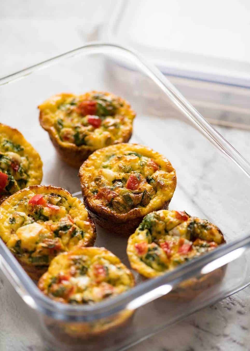 Healthy doesn't have to be bland! These Healthy Egg Muffins are a great grab & go breakfast option. Egg, spinach, feta, cherry tomatoes and bell peppers/capsicum. staging.recipetineats.com