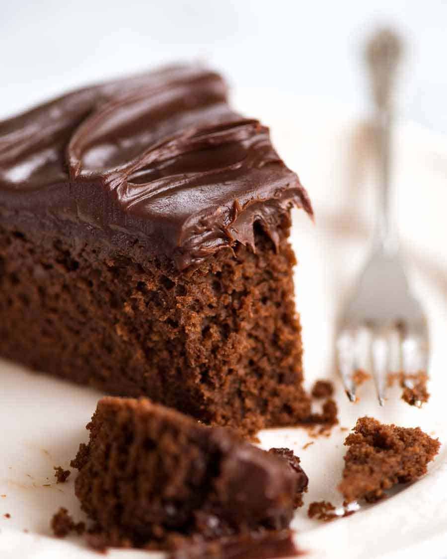 Close up of slice of Easy Chocolate Fudge Cake, ready to be eaten