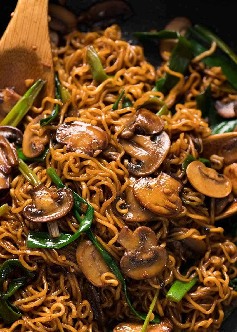 Close up of Asian Mushroom Ramen Noodles in a black skillet, fresh off the stove