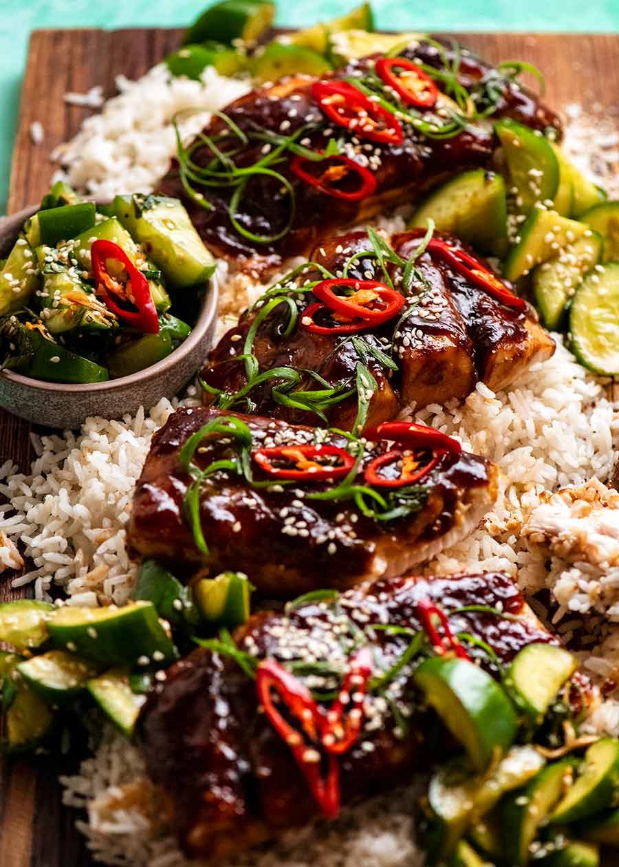 Asian Glazed Baked Barramundi on a platter with coconut rice and cucumber salad